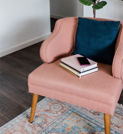 Canva - Phone and Notebooks on Armchair (1)_